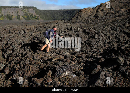 Kilauea iki crater hikers on trail near a`a lava Volcanos National Park Hawaii Stock Photo